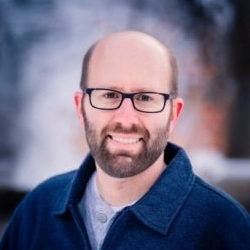 A headshot photo of optometrist Dr. Bradley Budge from Logan Optical