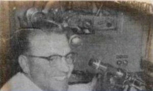 Eye Doctor Logan UT Ross Larsen A black and white photo of Logan Optical's founder, Ross Larsen, using diagnostic equipment.